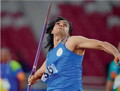  ?? AFP ?? India’s Neeraj Chopra created a new national record on his way to the men’s javelin gold in Jakarta on Monday. —