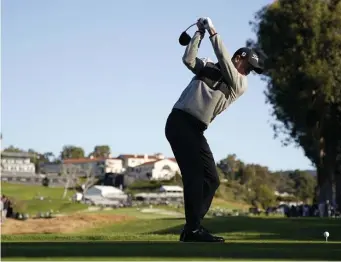  ?? ASSOCIATED PRESS ?? GRIP AND RIP: Second-round co-leader Justin Thomas tees off at the ninth hole during the Genesis Open yesterday at Riviera Country Club.