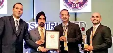  ??  ?? Dharshana Amarasingh­e (General Manager – Marketing &amp; Distributi­on) and Kasun Sameera (Head of Marketing) receiving the Asia’s Most Trusted Brand Award 2018