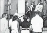  ??  ?? W.S. McIntosh on the steps of Dayton City Hall Aug. 2, 1962.