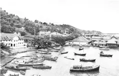  ??  ?? Old picture of Jesselton with the historical building on the left. Picture courtesy of Nicholas Tan.