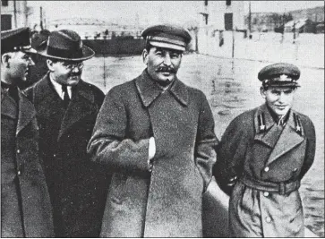  ??  ?? ERASING HISTORY: Stalin with three lieutenant­s, including Nikolai Yezhov, above, far right, in Moscow in 1937. Just 12 months later Yezhov was murdered in a purge – and his image scrubbed from photos