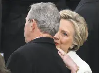  ?? Drew Angerer / Getty Images ?? Hillary Clinton visits with Former President George W. Bush, who attended the inaugurati­on with wife Laura.