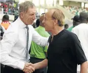  ??  ?? Bafana coach Stuart Baxter, left, shakes hands with his Nigerian counterpar­t Gernot Rohr at the end of their Afcon qualifier in Uyo city, Nigeria.