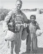  ?? CAPT. BRIAN HUYSMAN ?? Frank Biggio and Ishmael in Helmand province, Afghanista­n, in 2009.