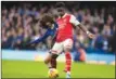  ?? AP PHOTO/KIRSTY WIGGLESWOR­TH ?? Arsenal’s Bukayo Saka, right, challenges for the ball with Chelsea’s Marc Cucurella during the English Premier League soccer match in London, Nov. 6.