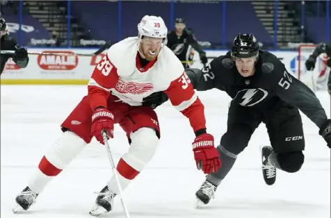  ?? Associated Press ?? With the championsh­ip window beginning to close on the Alex Ovechkin-led roster, Washington went all in to acquire Anthony Mantha, left, by trading wingers Jakub Vrana and Richard Panik, a 2021 first- and a 2022 second-round pick to Detroit.