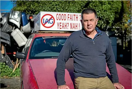  ?? PHOTO: DAVID WALKER/FAIRFAX NZ ?? Peter Glasson believes insurance company IAG has deliberate­ly held up his claim process and is advertisin­g his position by using a moving billboard - his car.