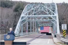  ?? EVAN VUCCI/AP ?? President Joe Biden promotes infrastruc­ture spending on Nov. 16 while visiting a bridge spanning the Pemigewass­et River in Woodstock, New Hampshire.