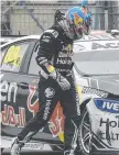  ?? Picture: EVAN MORGAN ?? Jamie Whincup inspects his crashed car.