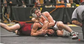  ?? SUBMITTED BY CHRIS WOODARD ?? Don Bosco’s Ben Garcia holds down Pompton Lakes’ Chad McConnell in the Region 1 165-pound semifinals on Feb. 24 at West Milford High School.