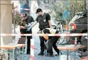  ?? DANIEL KARMANN/DPA ?? German police work the scene Monday of a Sunday blast.