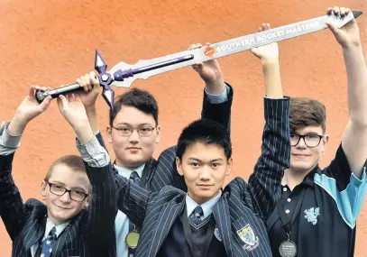  ?? PHOTO: PETER MCINTOSH ?? Victors . . . Holding up the trophy sword for the Southern Rocket Masters Open Competitio­n are King’s High School pupils (from left) Alex McKean (16), Max Hodgins (15), ChayHong RasmeySuos (16) and Ryan Hawker (16) yesterday.