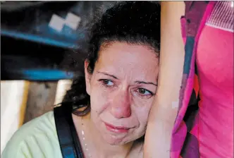  ?? BILAL HUSSEIN, THE ASSOCIATED PRESS ?? A relative of a missing soldier who was kidnapped by Islamic State militants weeps in the tent set up in downtown Beirut, Lebanon, Sunday.