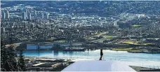  ?? LEO ZUCKERMAN/DESTINATIO­N BC ?? A skier takes in the stunning view at the top of the Cut Jump Line on Grouse Mountain.