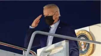  ?? Ap ?? POINTS OFF: President Biden salutes Friday as he boards Air Force One for a trip to New York. A CNN poll finds 69% think the country is heading in the wrong direction.