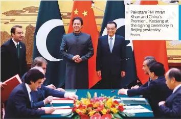  ?? Reuters ?? Pakistani PM Imran Khan and China’s Premier Li Keqiang at the signing ceremony in Beijing yesterday.