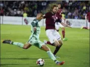  ?? ROMAN KOKSAROV — THE ASSOCIATED PRESS FILE ?? In this file photo, Latvia’s Kaspars Gorkšs, right, and Portugal’s Cristiano Ronaldo fight for the ball during their World Cup Group B qualifying match in Riga, Latvia.