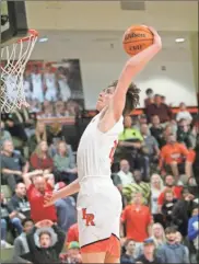  ?? Scott Herpst ?? Aidan Hadaway soars to the hoop for a dunk during LaFayette’s playoff opener against North Hall last Wednesday. Hadaway and the Ramblers rolled past the Trojans before a hard-fought win over Greater Atlanta Christian on Saturday that put the program into the Elite Eight for the third time in the last four seasons.