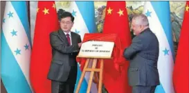  ?? FENG YONGBIN / CHINA DAILY ?? State Councilor and Foreign Minister Qin Gang (left) and Honduran Foreign Minister Enrique Reina attend a ceremony to inaugurate the embassy of the Republic of Honduras, in Beijing, on June 11.