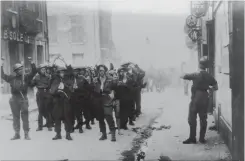  ?? HAMILTON SPECTATOR FILE PHOTO ?? August 1942, Canadian soldiers, now prisoners, marched through the streets of Dieppe just after the surrender to the German forces.