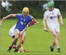  ??  ?? Wicklow’s David Maloney comes under pressure from Kildare’s Ben Reddan during the Celtic Challenge in Ballinakil­l, Rathdrum. Picture: Garry O’Neill