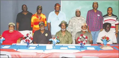  ?? Janice McIntyre/News-Times ?? Camp: Local veterans who were treated to lunch on Monday by St. John Missionary Baptist Church, Fairview Community Developmen­t Associatio­n, ‘Waiting to Excel’ summer camp, include, seated, from left, Roy Bullock, Olice Green, Robert White, Eugene White...