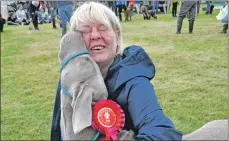  ?? 16_T32_Bunessansh­ow15 ?? Lapping up attention from proud owner Julie Brown is Duke who won best gun dog.