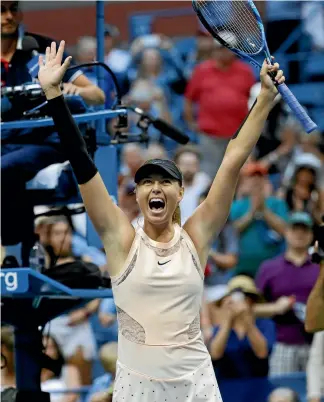  ?? PHOTO: REUTERS ?? Maria Sharapova celebrates after beating Timea Babos, of Hungary, 6-7 (4), 6-4, 6-1 to march into the third round of the US Open in New York yesterday.
