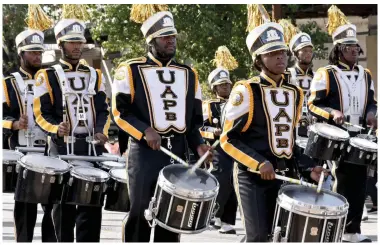  ?? (Pine Bluff Commercial/I.C. Murrell) ?? Members of the UAPB drumline strike up the beat as they march down Main Street.