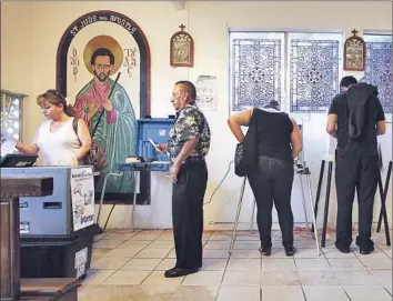  ?? Brian van der Brug
Los Angeles Times ?? VOTERS CAST ballots at the House of Mercy in Los Angeles for the 2012 presidenti­al election. An estimated 40 million Latinos will be eligible to vote in the U.S. by 2030, up from about 25 million in 2014.