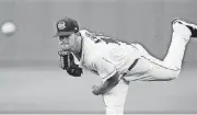  ?? ARCHIVES] [OKLAHOMAN ?? Oklahoma City’s Dallas Keuchel pitches in 2012.