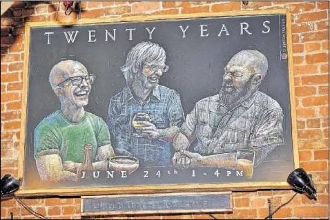  ?? PHOTOS CONTRIBUTE­D BY CHRIS HUNT ?? A beautifull­y detailed chalkboard illustrati­on by Josh Jameson of the Brick Store Pub’s founders hangs on the wall near the bar to commemorat­e the bar’s 20th anniversar­y.