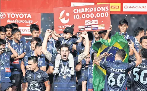  ??  ?? Buriram United players celebrate their Thai League 1 title-winning success.