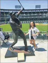  ?? VINCE ADAMO VIA AP ?? In this photo provided by Vince Adamo, Chicago White Sox fan Gabby Adamo poses beside a statue of Frank Thomas at Guaranteed Rate Field in Chicago. Adamo rooted for the White Sox throughout a three-year battle with leukemia. But she never got to attend an opening day game featuring her favorite team. Eight months after she died at the age of 22, her parents and the White Sox are doing what they can to rectify that. With no spectators permitted at stadiums due to the coronaviru­s pandemic, the White Sox are among the Major League Baseball teams giving fans the opportunit­y to fill some seats with their photograph­s on cutouts. So when the White Sox open July 24 against the Minnesota Twins, in the stands will be a cutout featuring a smiling Gabby Adamo wearing a White Sox jersey and cap.
