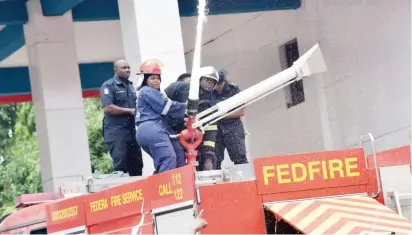  ?? Photo: NAN ?? Firefighte­rs demonstrat­ing during the commemorat­ion of Internatio­nal Firefighte­rs Day in Abuja yesterday