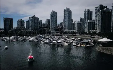  ?? DARRYL DYCK/The Canadian Press files ?? A new report dismisses talk of overbuildi­ng in the condo market in Canada. In the background are Vancouver’s Yaletown
condo towers near False Creek.