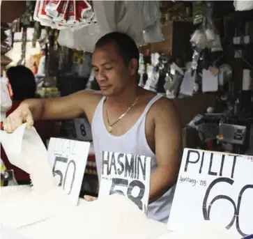  ?? ?? Well-milled rice prices are seen to go down to P44 to P46 a kilo following the price drop abroad.