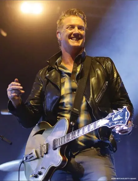  ?? MARK METCALFE/GETTY IMAGES ?? Josh Homme of Queens of the Stone Age says it’s important to the band that their music continues to surprise people.