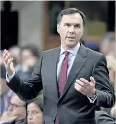  ?? ADRIAN WYLD/THE CANADIAN PRESS ?? Finance Minister Bill Morneau says “not everything is money,” but Wednesday’s federal budget will still be “transforma­tive” and “bold.”