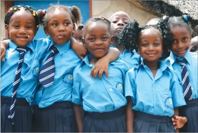  ??  ?? Bright Daisies Junior School Grade 1 pupils enjoy their first day at school in Chitungwiz­a yesterday. — (Picture by Tawanda Mudimu)