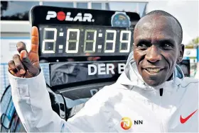  ??  ?? Landmark feat: Eliud Kipchoge celebrates his stunning world record in Berlin
