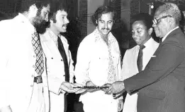  ?? GLEANER PHOTOGRAPH ?? AWARD FOR EXCELLENCE: From left: Patrick Stanigar, David Twiss, Stephen Medes and Evan Williams receiving the Governor General’s Award for Excellence from Governor General Sir Florizel Glasspole at the Architectu­re Week dinner and dance at Devon House.