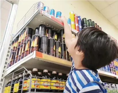  ??  ?? While it is illegal to sell energy drinks to those under the age of 16, many children purchase it from shops.