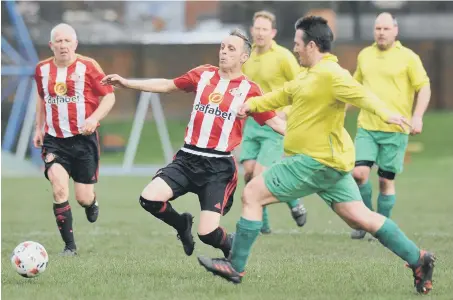  ??  ?? Mill View SC (stripes) fight for the ball against Darsley Park last weekend. Picture by Tim Richardson.