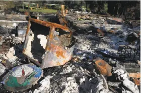  ?? Paul Chinn / The Chronicle ?? The fire safe that Matthew and Coby Stockton used to store important documents lies among the debris of their Santa Rosa home.