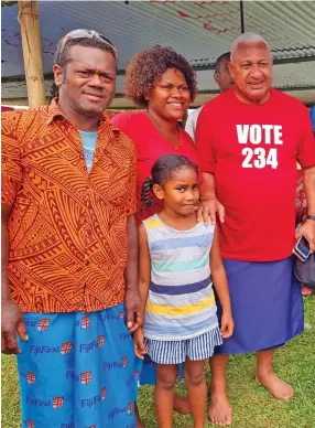  ?? Photo: Sampras Anand ?? From left: Buca Village headman, Esala Nukumasia, COVID-19 inflation mitigation child assistance recipient, mother-of-two, Taraivosa Tamaue, 30, with FijiFirst party leader, Voreqe Bainimaram­a on December 1, 2022.