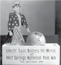  ?? Submitted photo ?? ■ This souvenir features two often-used slogans, “Uncle Sam Bathes the World” and “The Nation’s Spa,” that promoted the health resort at Hot Springs. Photo is courtesy of the Garland County Historical Society. Historical Society.