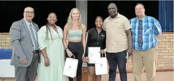  ?? Picture: MARK CARRELS ?? TOP PERFORMANC­E: Celebratin­g the amazing achievemen­t of Port Alfred High School’s 2023 matric class are, from left, proud headmaster Nigel Adams, maths literacy HoD Grace Tyutyu, the school’s top two matriculan­ts, Alyson van der Merwe and Lathitha Gobane, physical sciences HoD Wellington Makoni and Life orientatio­n teacher Richard Herrington.