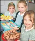  ?? Picture: Gary Browne FM4318234 ?? Talia Simpson, Isla Hardwick and Scarlett Adams ran a cake sale at Smarden School
